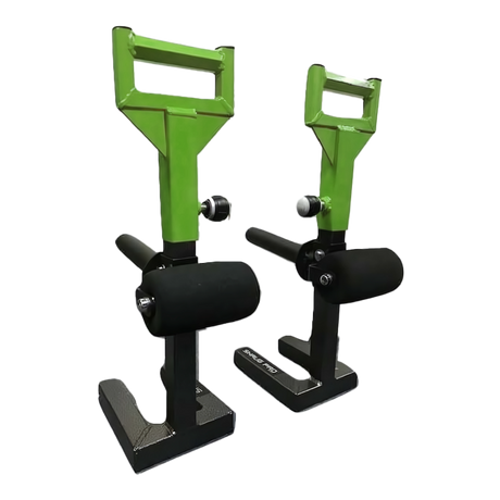 Two green and black SHRUG PRO Freestanding Hex Bars serve as a barbell shrug alternative without rollers, featuring sturdy bases, ideal for use with a trap bar or on a freestanding shrug platform.