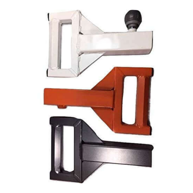 Set against a white background, three bold metal door latches in white, orange, and black evoke the sturdy design of the 'SHRUG PRO' Freestanding Hex Bars Trap Bar. Perfect for your home gym's aesthetic, they seamlessly marry form with function.