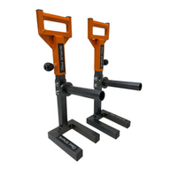 The "SHRUG PRO" freestanding hex bars, with their orange and black squat handles, enhance fitness or weightlifting setups, especially when paired with a farmers walk platform.