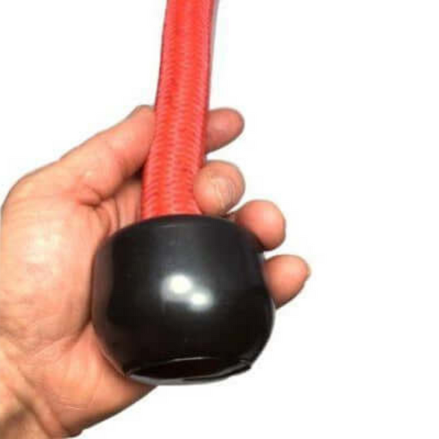 A cushioned grip holds the TRICEPS ROPE EXTREME 'Singles' with a red rope and round black end cap.