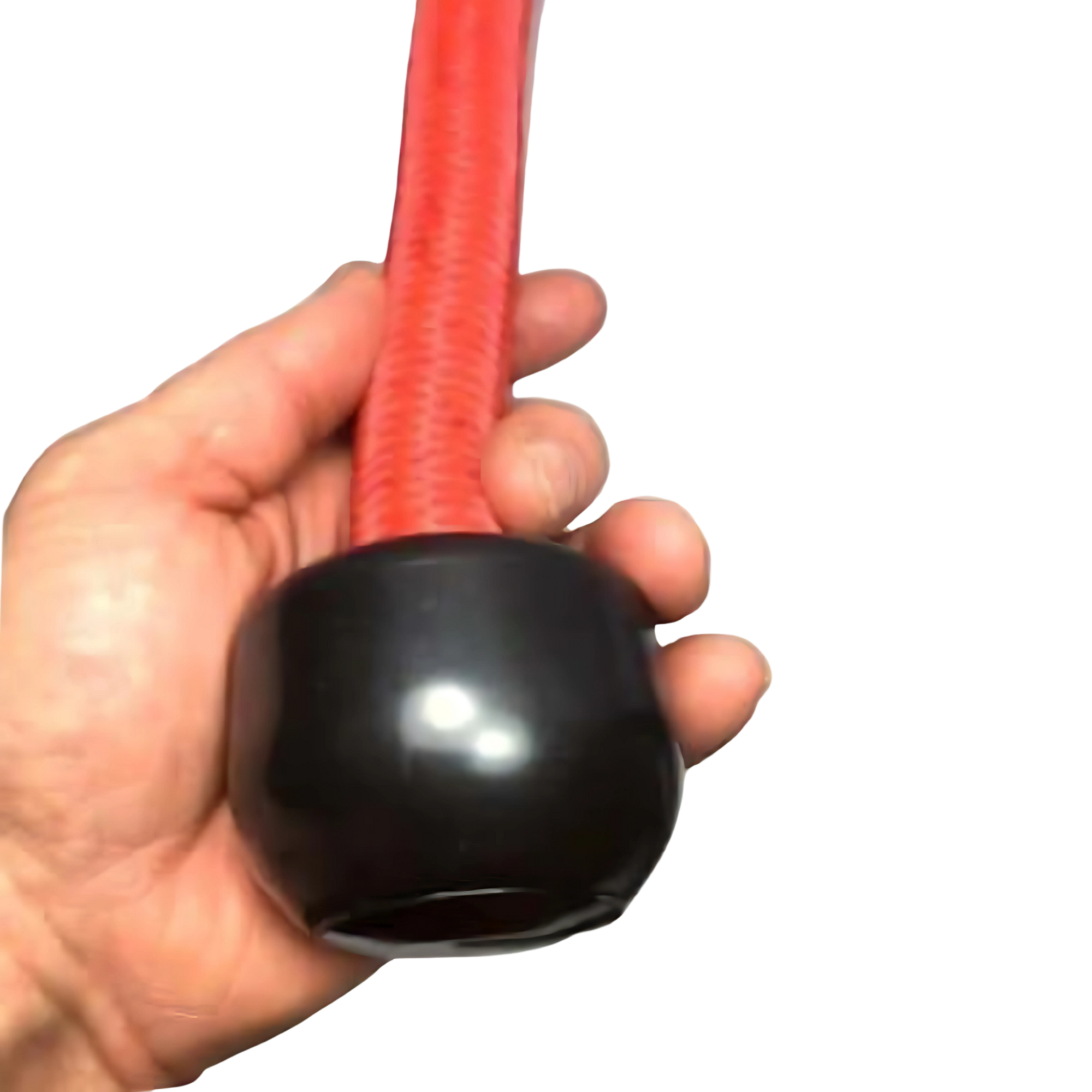 A hand holds the TRICEPS ROPE EXTREME 'Singles'—a red flexible triceps cable workout rope with a shiny black rounded cap and cushioned grip at the end.