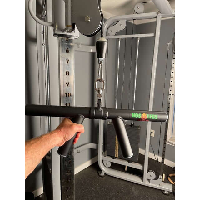 HOG lEGS Boar Tusk suspended from a Dual Cable Exercise Machine